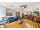 Cozy living room featuring a plush sofa, wooden floors, and a built-in bar area at 698 Bellemeade Nw Ave, Atlanta, GA 30318