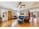Spacious living room boasts hardwood floors, warm paint colors, and neutral-toned furniture at 698 Bellemeade Nw Ave, Atlanta, GA 30318