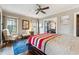 Sunlit bedroom with hardwood floors, decor, and multiple windows, including stained glass at 698 Bellemeade Nw Ave, Atlanta, GA 30318