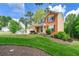 Attractive home showcasing a well-maintained lawn and a mix of brick and siding exterior finishes at 7260 Foxberry Ct, Cumming, GA 30041
