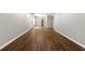 Open-concept living room features new wood-look floors and plenty of space at 7260 Foxberry Ct, Cumming, GA 30041