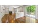 Open-concept living room featuring a fireplace and sliding glass doors that lead to an outdoor deck at 7260 Foxberry Ct, Cumming, GA 30041