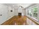 Spacious living room with hardwood floors and a fireplace, perfect for entertaining guests or relaxing with Gathering at 7260 Foxberry Ct, Cumming, GA 30041