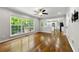 Cozy living area filled with natural light, offering a view to the kitchen and a private outdoor deck at 7260 Foxberry Ct, Cumming, GA 30041