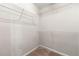 Walk-in closet featuring wire shelving to organize wardrobe at 7260 Foxberry Ct, Cumming, GA 30041