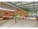 Spacious barn interior with high ceilings and an outdoor living setup, offering rustic charm and ample room to enjoy at 151 Mark Se Ln, Smyrna, GA 30082