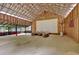 Rustic barn interior featuring an outdoor living setup, high ceilings, and natural wood walls, a unique entertaining space at 151 Mark Se Ln, Smyrna, GA 30082
