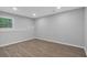 Bright bedroom with hardwood floors and a window letting in natural light at 151 Mark Se Ln, Smyrna, GA 30082