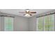 Bright bedroom with plantation shutters, modern ceiling fan, and ample natural light at 151 Mark Se Ln, Smyrna, GA 30082