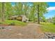 View of home with brick facade and basketball court on a spacious lot at 151 Mark Se Ln, Smyrna, GA 30082