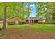 Traditional-style home with a brick facade, complemented by lush landscaping at 151 Mark Se Ln, Smyrna, GA 30082
