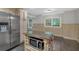 Kitchen features stainless steel appliances and stone countertop island with microwave at 151 Mark Se Ln, Smyrna, GA 30082
