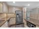 Kitchen boasts stainless steel appliances, and a stone countertop island with microwave at 151 Mark Se Ln, Smyrna, GA 30082