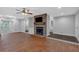 Living room showcasing a stone fireplace, brick flooring, and natural light at 151 Mark Se Ln, Smyrna, GA 30082
