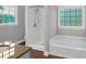Main bathroom with a separate tub and shower, and granite countertop at 151 Mark Se Ln, Smyrna, GA 30082