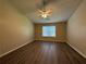 Bright bedroom with a ceiling fan and a window offering natural light at 16 Grandview Ct, Powder Springs, GA 30127