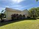 Home exterior features manicured green lawn and flowering shrubs at 16 Grandview Ct, Powder Springs, GA 30127