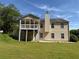 Home's exterior shows a spacious backyard with a deck and mature trees, perfect for outdoor activities at 16 Grandview Ct, Powder Springs, GA 30127