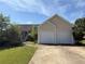 Charming home with a two-car garage and well-maintained lawn in a suburban neighborhood at 16 Grandview Ct, Powder Springs, GA 30127