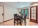 Cozy dining area featuring hardwood floors and a table set for four at 2687 Goodfellows Rd, Tucker, GA 30084