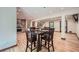 Dining area with hardwood floors, a dark wood table set for four, and natural light at 2687 Goodfellows Rd, Tucker, GA 30084