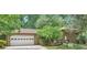 Charming brick home with a well-manicured front yard and attached two-car garage at 2687 Goodfellows Rd, Tucker, GA 30084