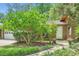 Brick home with manicured landscaping, stone walkway, and a lush lawn at 2687 Goodfellows Rd, Tucker, GA 30084