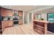 Bright kitchen with stainless steel appliances, wood cabinets, and a breakfast bar at 2687 Goodfellows Rd, Tucker, GA 30084