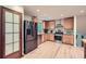 Bright kitchen with hardwood floors, stainless steel appliances, and modern wooden cabinetry at 2687 Goodfellows Rd, Tucker, GA 30084