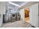 View of the laundry room with washer, dryer, hot water heater and storage, plus access to the interior of the house at 2687 Goodfellows Rd, Tucker, GA 30084
