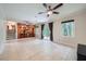 Spacious living room with neutral walls, tiled floors, and sliding glass doors to the backyard at 2687 Goodfellows Rd, Tucker, GA 30084