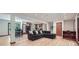 Open concept living room showcasing hardwood floors, a large sofa, and an open floor plan at 2687 Goodfellows Rd, Tucker, GA 30084