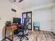 Home office setup with stylish chair, desk, sliding closet door, and hardwood-style flooring at 2687 Goodfellows Rd, Tucker, GA 30084