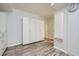Spacious storage area with plank flooring and several large, white storage units at 2687 Goodfellows Rd, Tucker, GA 30084