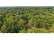 Aerial view with location pin of the home, nestled in a lush, green, treed landscape at 3270 Brookview Dr, Marietta, GA 30068