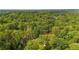 Secluded home nestled among mature trees in a lush, verdant landscape offering privacy at 3270 Brookview Dr, Marietta, GA 30068