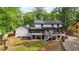 Expansive backyard view features a multi-tiered deck, lush greenery, and a well-maintained lawn at 3270 Brookview Dr, Marietta, GA 30068