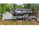 Expansive backyard features a multi-tiered deck, lush greenery, and a well-maintained lawn at 3270 Brookview Dr, Marietta, GA 30068