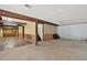 Unfinished basement space with exposed beams, partially finished walls, and a concrete floor at 3270 Brookview Dr, Marietta, GA 30068