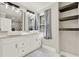 Bathroom featuring a double vanity with marble countertop and vessel sinks, and a glass-enclosed shower at 3270 Brookview Dr, Marietta, GA 30068