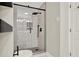 Tiled glass enclosed shower featuring a rainfall shower head and a handheld shower fixture at 3270 Brookview Dr, Marietta, GA 30068