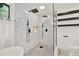 Bathroom featuring a walk-in shower with dual shower heads, marble tiling and a white toilet at 3270 Brookview Dr, Marietta, GA 30068