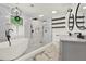 Bright bathroom featuring a soaking tub and walk-in shower with marble and stone accents at 3270 Brookview Dr, Marietta, GA 30068