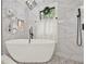 Modern bathroom featuring a standalone tub and a window with natural light and stylish decor at 3270 Brookview Dr, Marietta, GA 30068