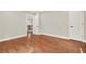 Spacious bedroom featuring hardwood floors, neutral walls, white trim, and staircase in view at 3270 Brookview Dr, Marietta, GA 30068