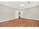 Large bedroom featuring gleaming hardwood floors, neutral walls, and access to a walk-in closet at 3270 Brookview Dr, Marietta, GA 30068
