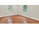 Bright bedroom featuring hardwood floors, neutral walls, white trim, and windows offering natural light at 3270 Brookview Dr, Marietta, GA 30068