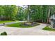 View of the circular driveway with mature landscaping and healthy green grass at 3270 Brookview Dr, Marietta, GA 30068