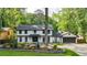Charming two-story home with brick accents, lush landscaping, and a well-manicured lawn creating inviting curb appeal at 3270 Brookview Dr, Marietta, GA 30068