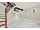 Elegant foyer showcasing a curved staircase, marble floors, and stylish lighting at 3270 Brookview Dr, Marietta, GA 30068